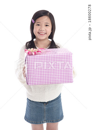 Cute asian girl giving a present Cute asian girl giving a present 18600278