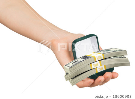 Empty green ring box with money in womans hand Empty green ring box with money in womans hand 18600903