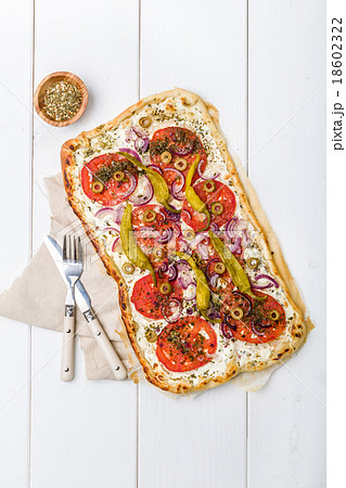 Spicy tarte flambee with pepperoni and olives Spicy tarte flambee with pepperoni and olives 18602322