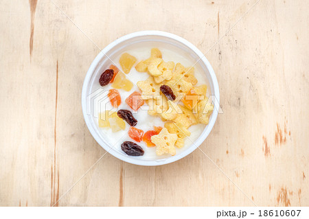 healthy flakes with yogurt in white plastic cup 18610607