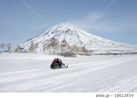 Tourist driving snow mobile, Kamchatka 18612659