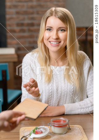 Pleasant girl sitting in the cafe  18615309