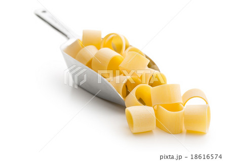 uncooked pasta calamarata in metal scoop uncooked pasta calamarata in metal scoop 18616574