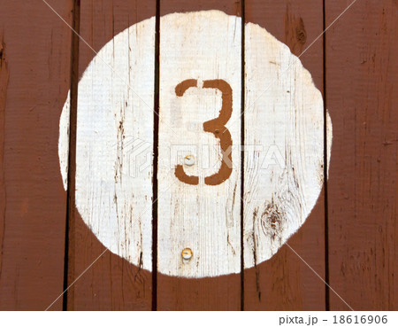 Number three on wooden painted wall. 18616906