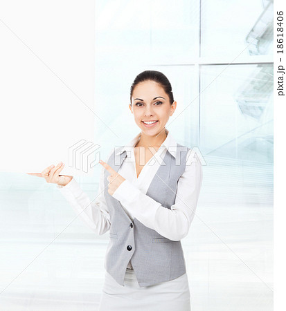 Businesswoman smile point finger white card board Businesswoman smile point finger white card board 18618406
