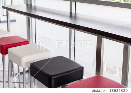 Color   chairs near bar, indoor 18625320