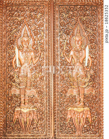 Thai Style Carving on the Temple Door Thai Style Carving on the Temple Door 18625352