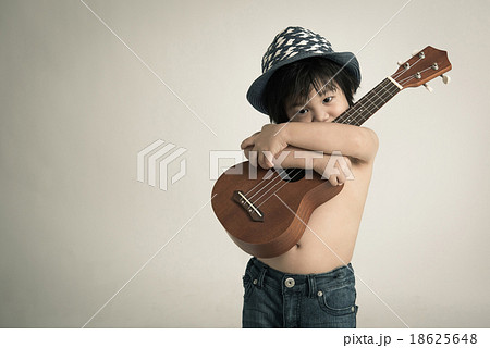 Little asian boy holding ukulele 18625648