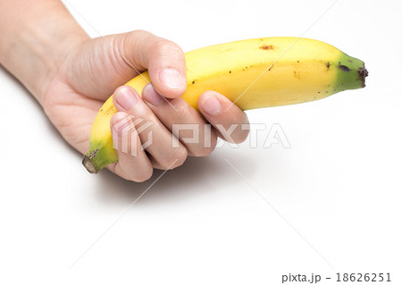 woman holding banana on whitebackground 18626251