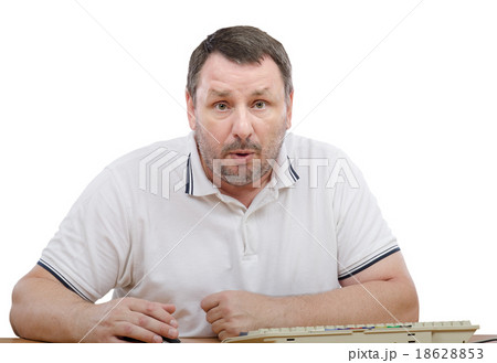Amazed man sitting at the desk 18628853