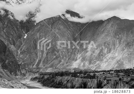 mountain peaks through the clouds 18628873