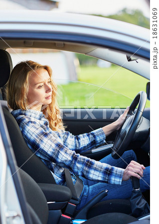 young woman driving a car young woman driving a car 18631069