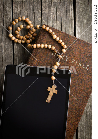 wooden rosary beads with computer tablet 18633122