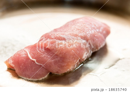 cooking meat in a frying pan cooking meat in a frying pan 18635740