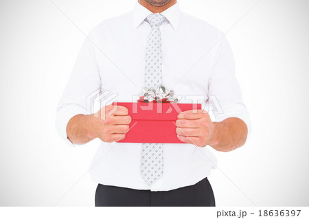 Composite image of businessman holding his hands out Composite image of businessman holding his hands out 18636397