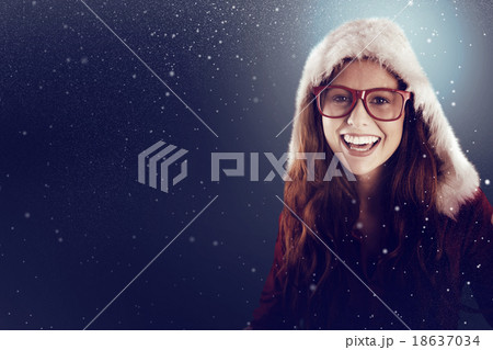Composite image of festive redhead smiling at camera Composite image of festive redhead smiling at camera 18637034