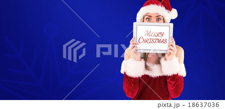 Composite image of pretty santa girl holding tablet Composite image of pretty santa girl holding tablet 18637036