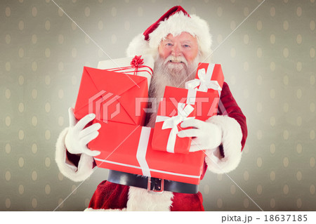 Composite image of santa carries a few presents Composite image of santa carries a few presents 18637185
