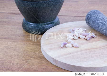 garlic on wood block garlic on wood block 18640504