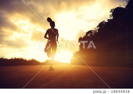 fitness woman running on sunrise seaside trail fitness woman running on sunrise seaside trail 18644838