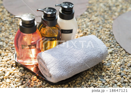 Bathroom amenity set on pebbles  18647121