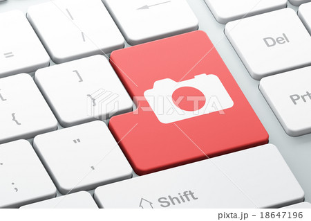 Tourism concept: Photo Camera on computer keyboard Tourism concept: Photo Camera on computer keyboard 18647196