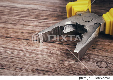 multitool pliers on wooden background multitool pliers on wooden background 18652298