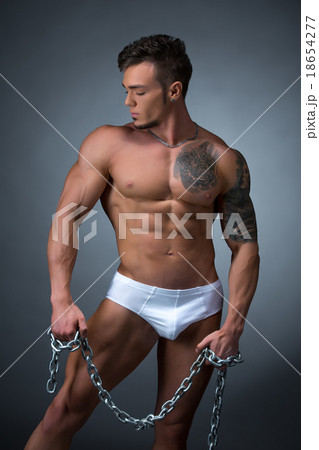 Seductive male model with perfect tattooed body Seductive male model with perfect tattooed body 18654277
