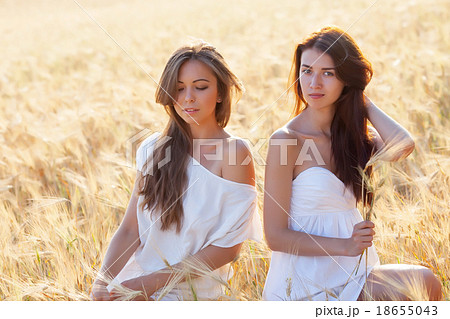 Two beautiful woman on the corn field Two beautiful woman on the corn field 18655043