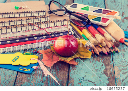 Office or school supplies on wooden planks. Office or school supplies on wooden planks. 18655227