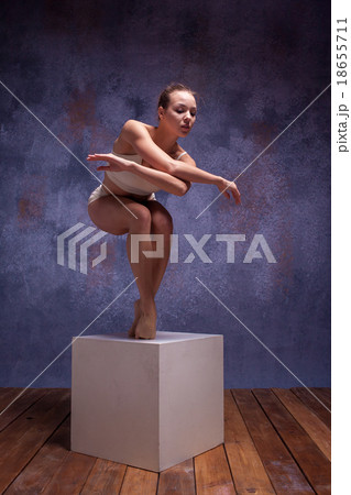 Young beautiful dancer in beige swimwear posing on Young beautiful dancer in beige swimwear posing on 18655711