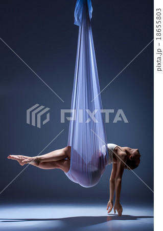 Young beautiful dancer in beige dress posing on 18655803