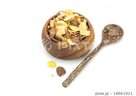 Cereal in wooden blow and wooden spoon Cereal in wooden blow and wooden spoon 18661921