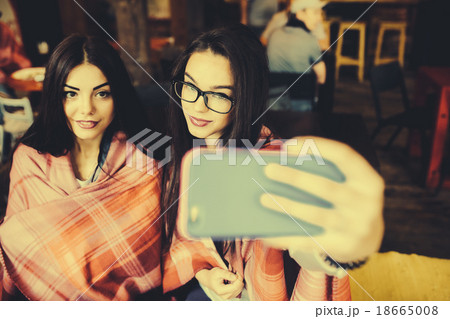two close friends do selfie in the cafe 18665008
