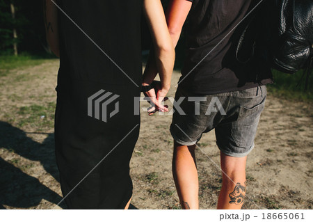 beautiful couple standing in a forest beautiful couple standing in a forest 18665061