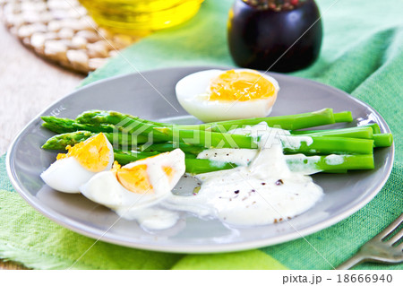 Asparagus with boiled eggs 18666940