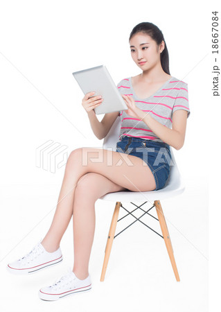 girl sitting on a chair 18667084