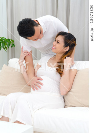 Asian man and his pregnant wife Asian man and his pregnant wife 18671856