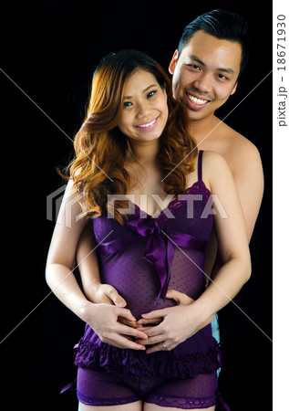 Asian man and his pregnant wife Asian man and his pregnant wife 18671930