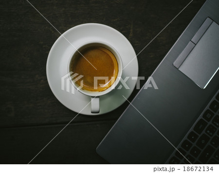 cup of coffee espresso with computer notebook  18672134