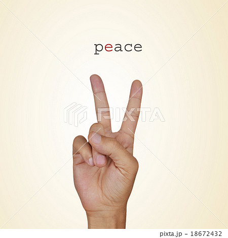 man hand giving the V sign and the word peace 18672432
