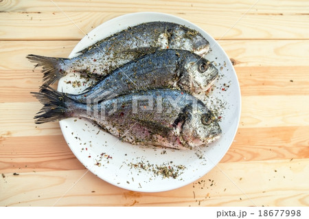 Fish on white plate background 18677998