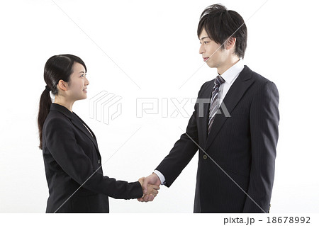 ビジネス 男女 握手 の写真素材