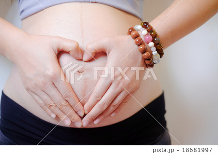 pregnant woman made her hand heart symbol pregnant woman made her hand heart symbol 18681997