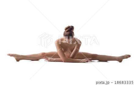 Nude female athlete doing gymnastic split Nude female athlete doing gymnastic split 18683335