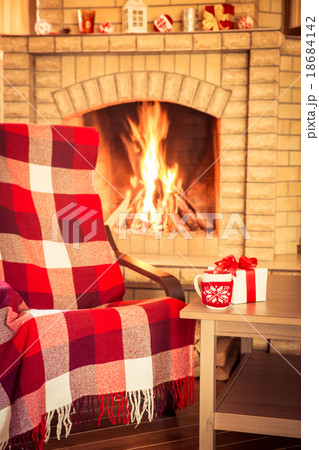 Armchair near fireplace 18684142