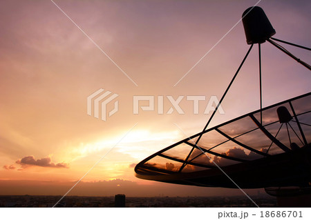 Satellite dish silhouette on twilight sky  18686701