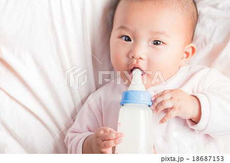 feeding newborn infant with feeding milk bottle 18687153
