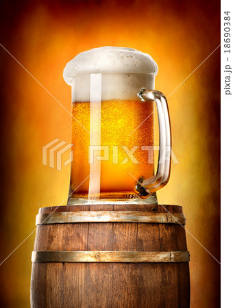 Beer with cask on yellow Beer with cask on yellow 18690384