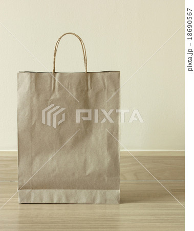 brown paper bag on the floor 18690567